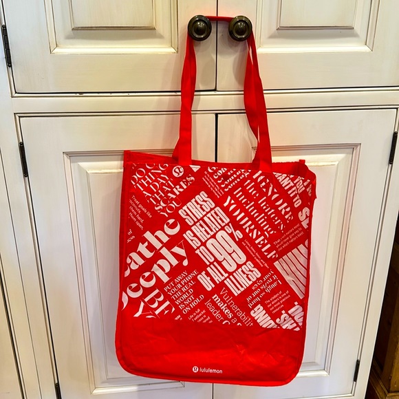 lululemon athletica Handbags - LULULEMON REUSABLE RED & WHITE LOVE TOTE BAG WITH RED HANDLES AND SNAP CLOSURE